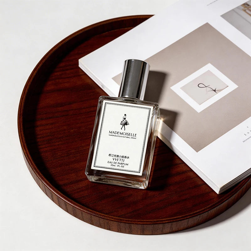 Vvetti Mademoiselle EDP: Rectangular glass bottle, elegant floral fruity fragrance for women. Long-lasting, light scent.
