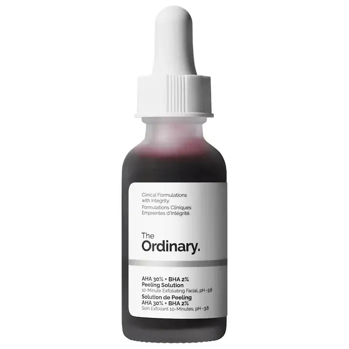 The Ordinary serum bottle with white dropper cap and dark red-brown liquid.