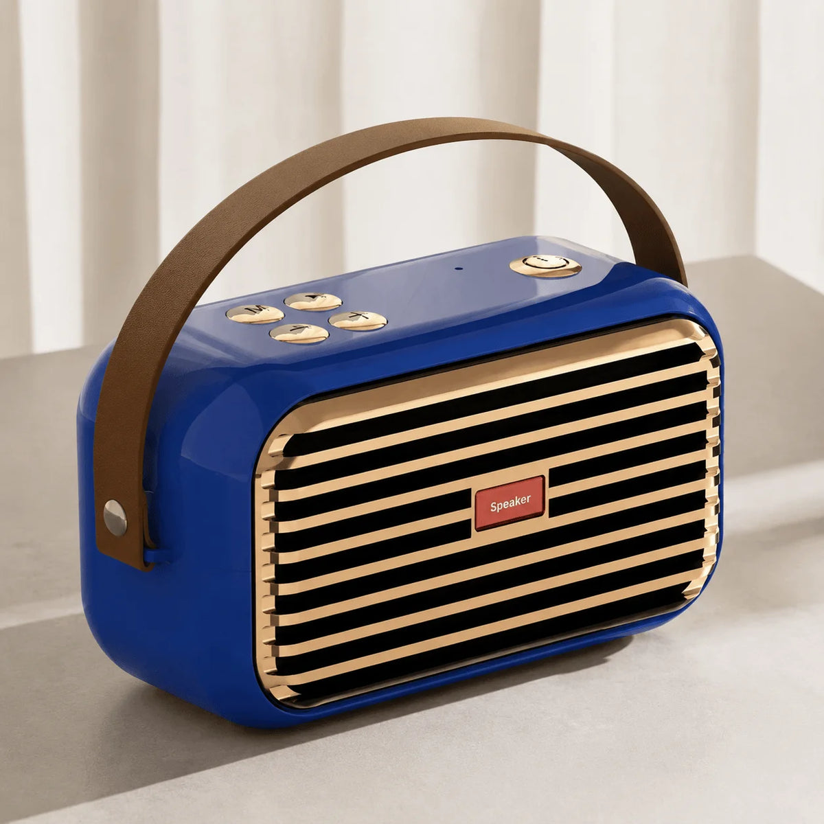 Blue portable Bluetooth speaker with carry handle and front speaker grille.