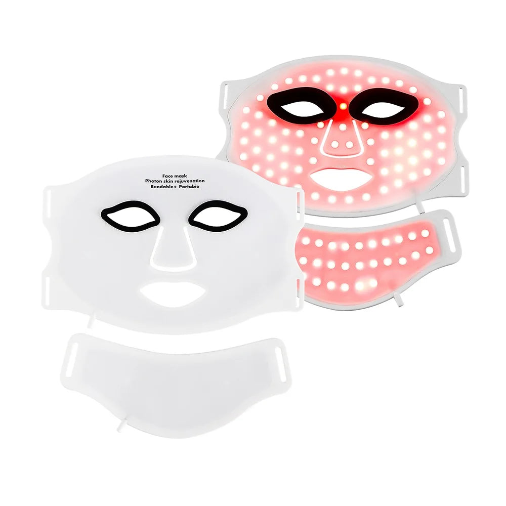 Two flexible white silicone LED face and neck masks, one inactive and one illuminated with red light therapy diodes.