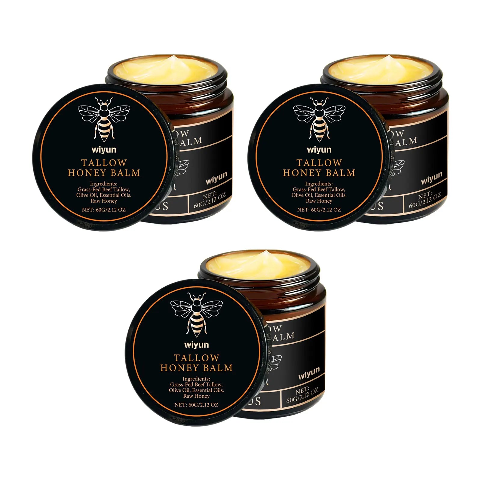 Honey tallow balm tins close-up, black round lid label with golden balm visible in open jar