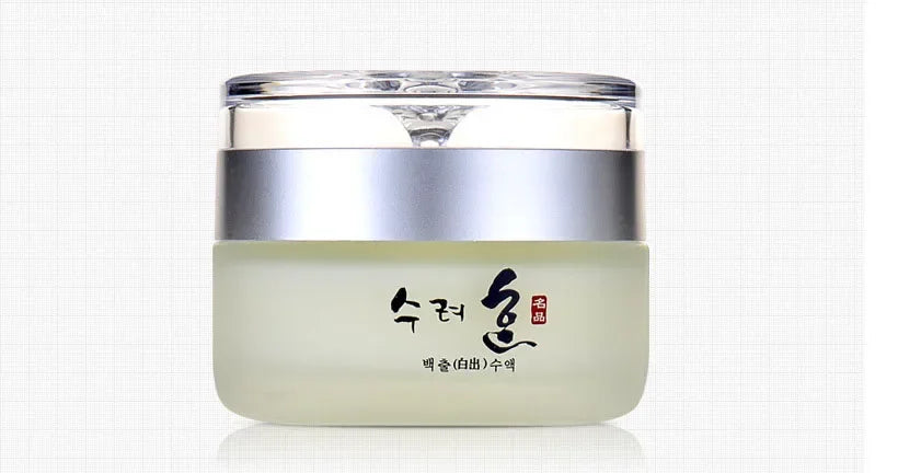 A frosted glass jar of collagen face cream with a silver lid and Korean text on a white grid background.