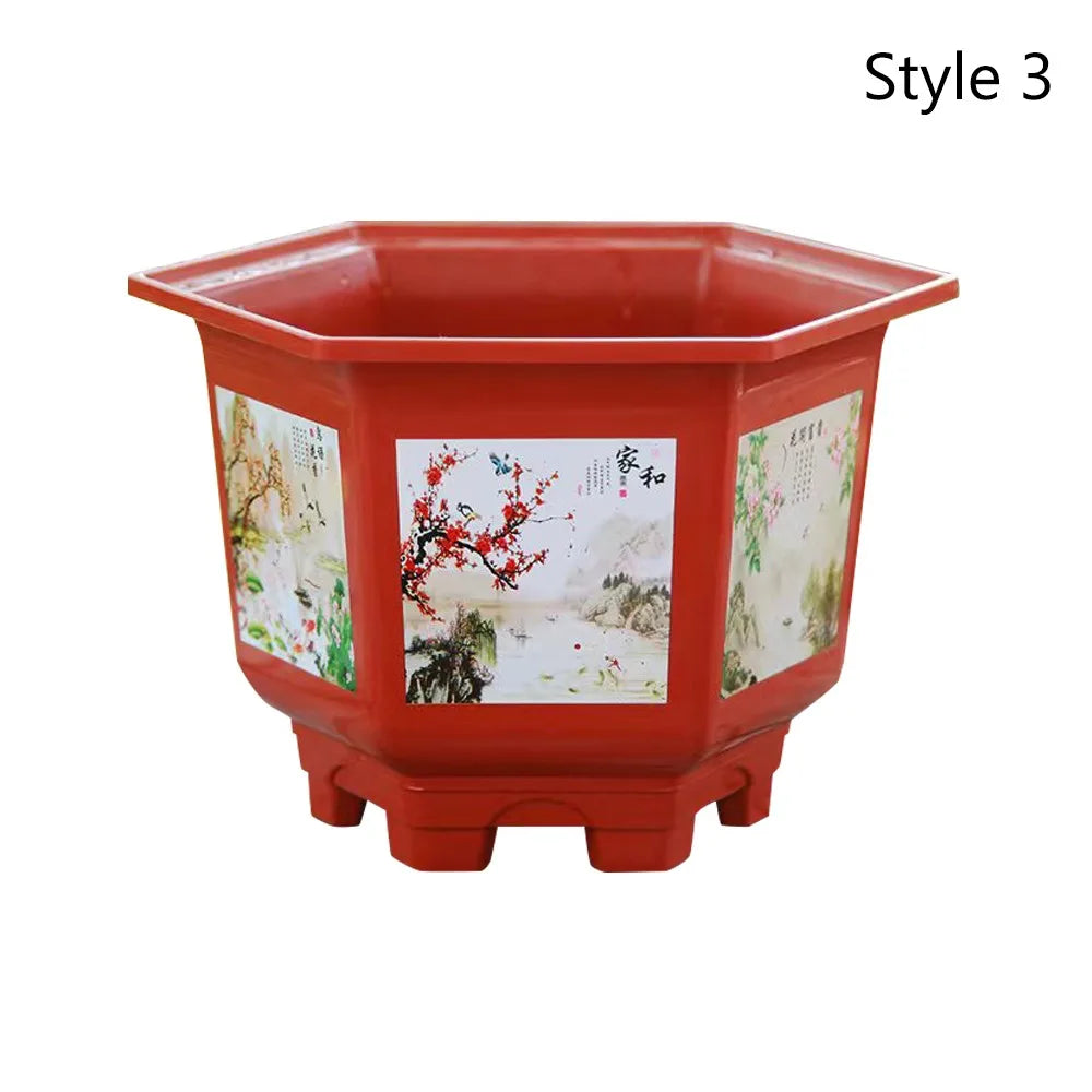 Red plastic bonsai planter with white floral artwork on the front and sides