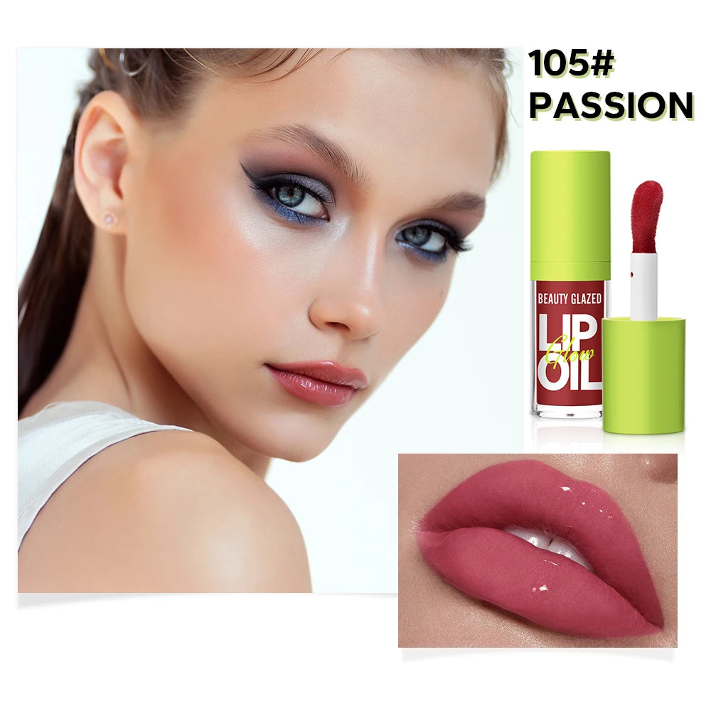 Moisturizing candy lip gloss in 105 Passion: a lustrous, mirror-finish nude lip stain with a natural, glossy texture.