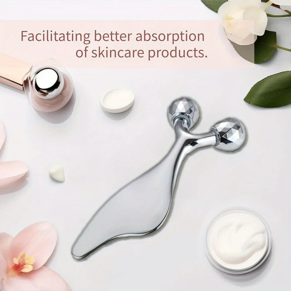 Silver, Y-shaped facial massager with dual diamond-cut rolling spheres and a smooth, ergonomic handle for sculpting.