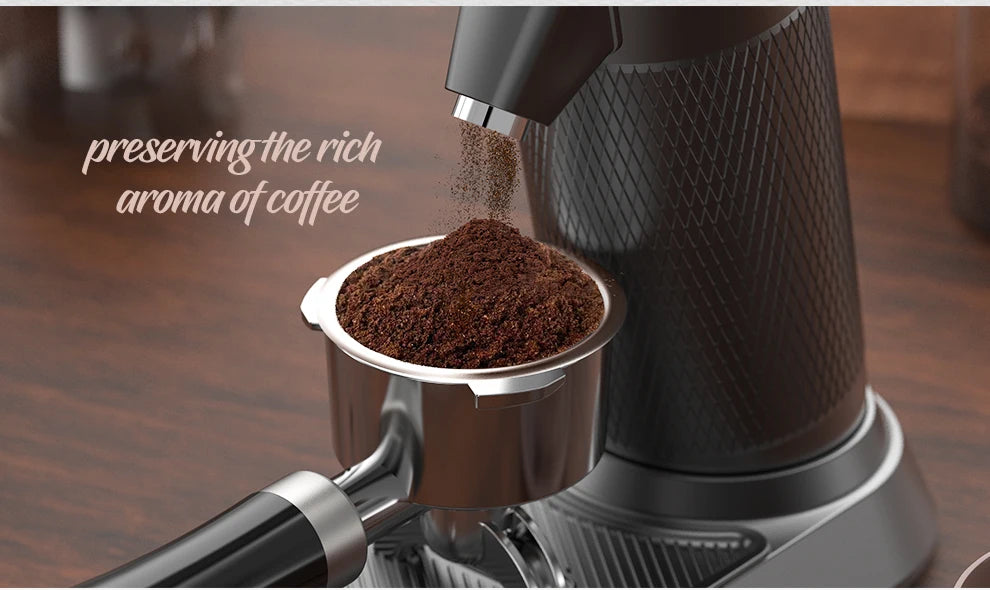 Black coffee grinder dispensing fresh grounds into a chrome metal portafilter on a textured matte stand.
