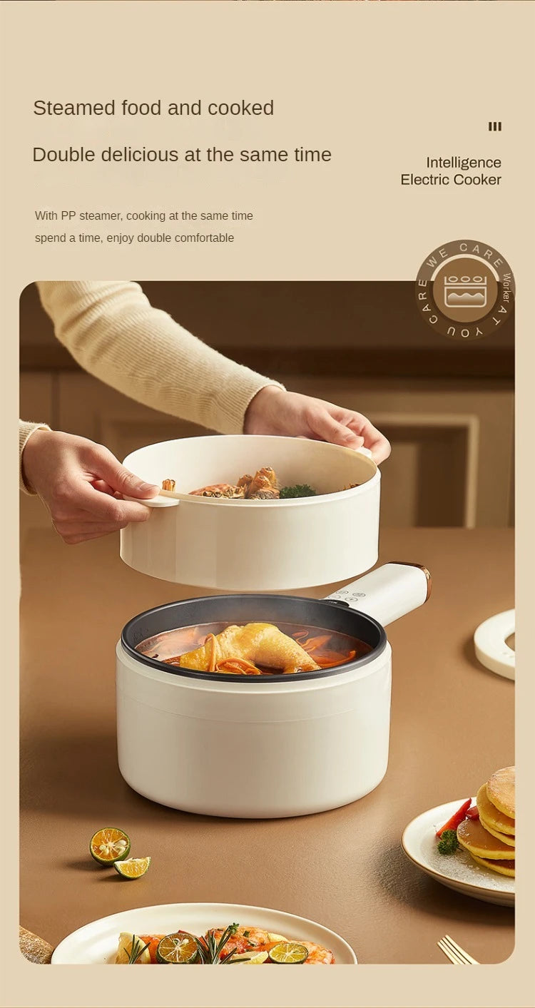 White electric cooking hot pot with lid and side handle, shown on countertop.