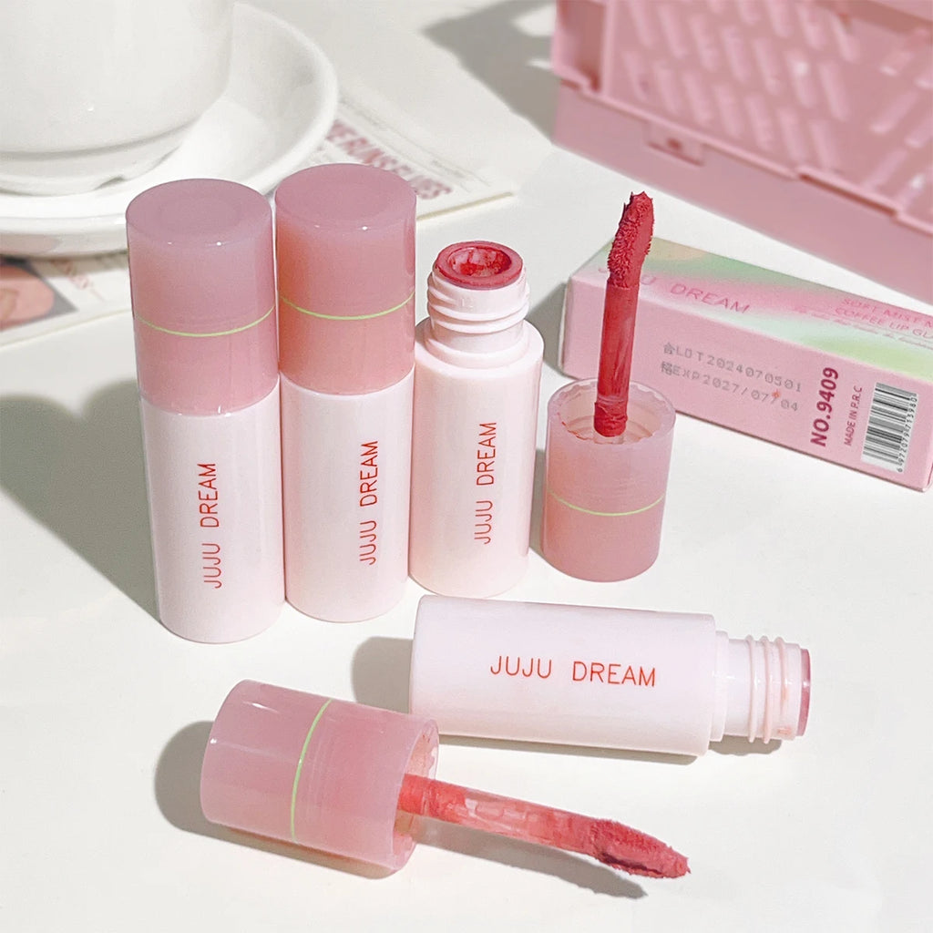 JUJU DREAM matte lip glaze set with pink tubes and velvet applicator, showing creamy pigment and long-lasting texture.
