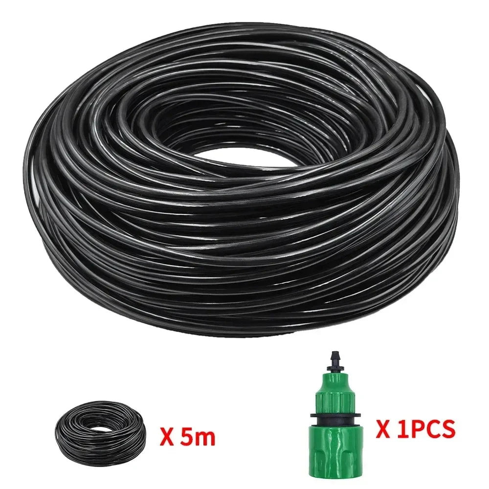 Coiled black drip irrigation tubing with green connector and small roll of spare hose