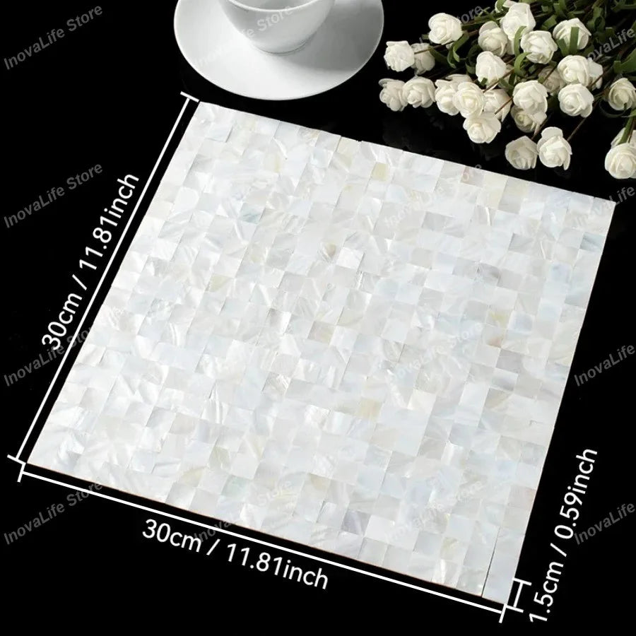 White mother-of-pearl mosaic tile sheet with glossy cube-texture square tiles