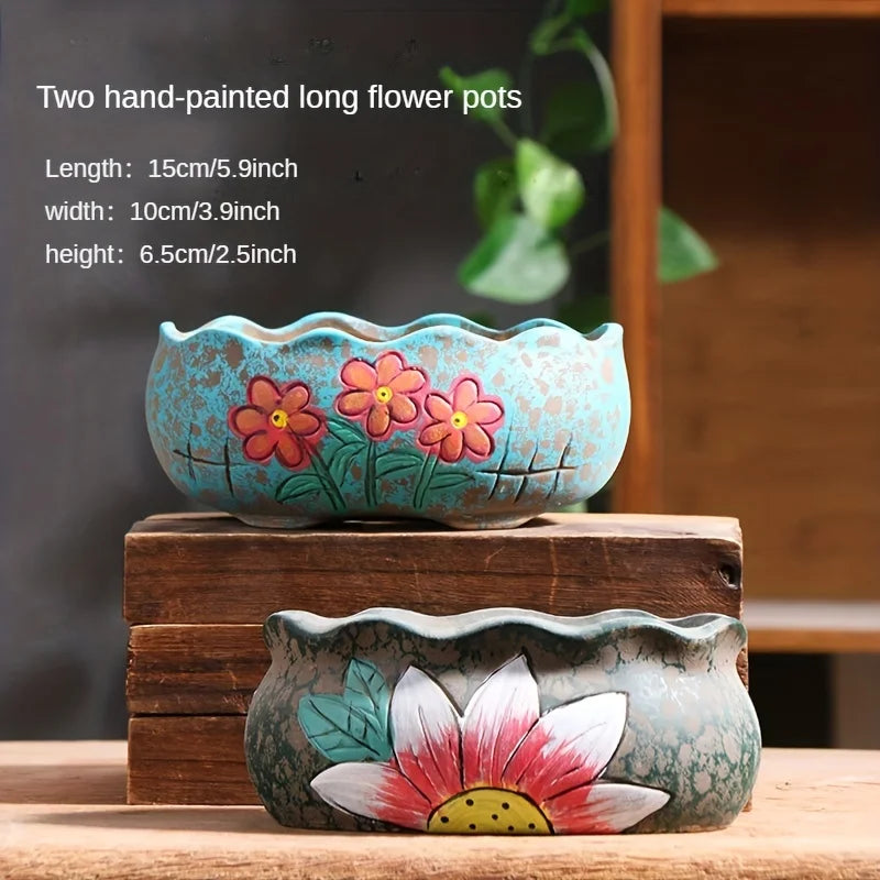 Ceramic oval planter set with turquoise blossoms; stacked large and small planters