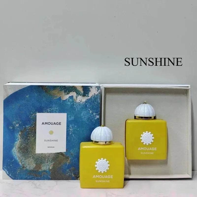 Amouage Sunshine Women 100ml: Yellow square perfume bottle with floral, vanilla, musk, and woody oriental scent notes.