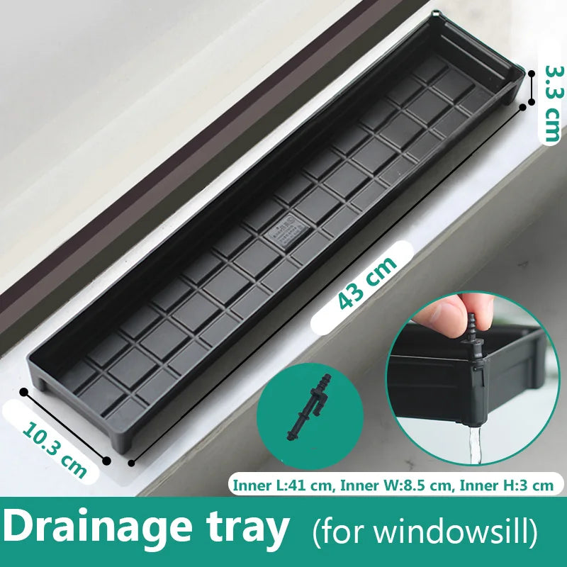 Black plastic drainage tray with grid channels and removable water plug for windowsill pots