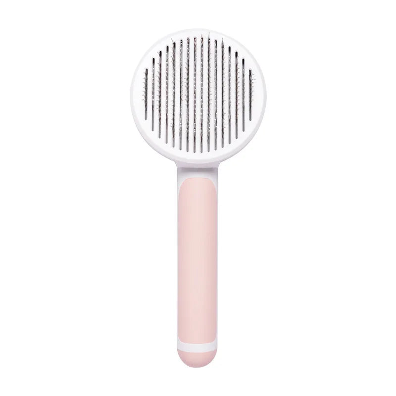 Self-cleaning slicker brush for dogs and cats with white and pink handle to remove loose hair and tangles.