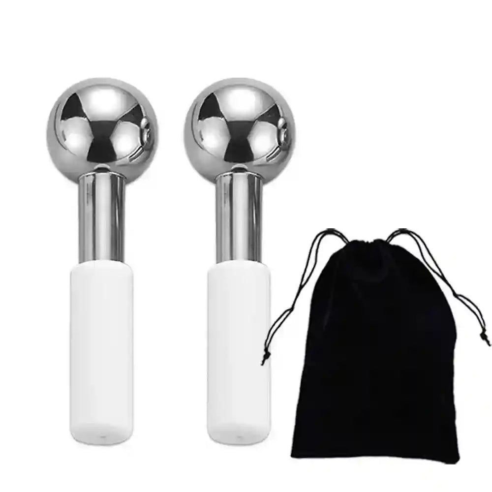 Two stainless steel facial ice globes with white handles, shown next to a black velvet storage pouch.