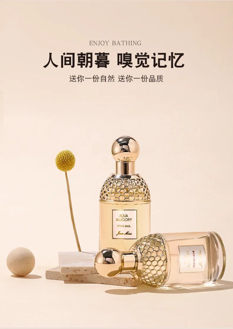Jean Miss Aqua Allegory EDT perfume: Citrus Basil & Delicate Rose floral scent in gold honeycomb glass spray bottles.