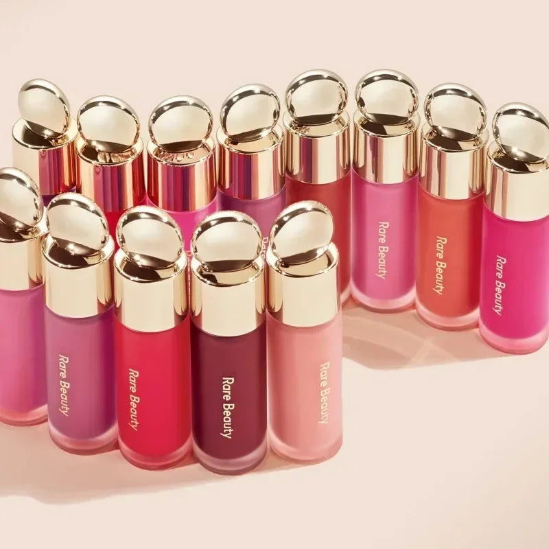 Rare Beauty matte lipsticks in rich colors with gold caps, offering a smooth, moisture-rich finish for lip makeup.