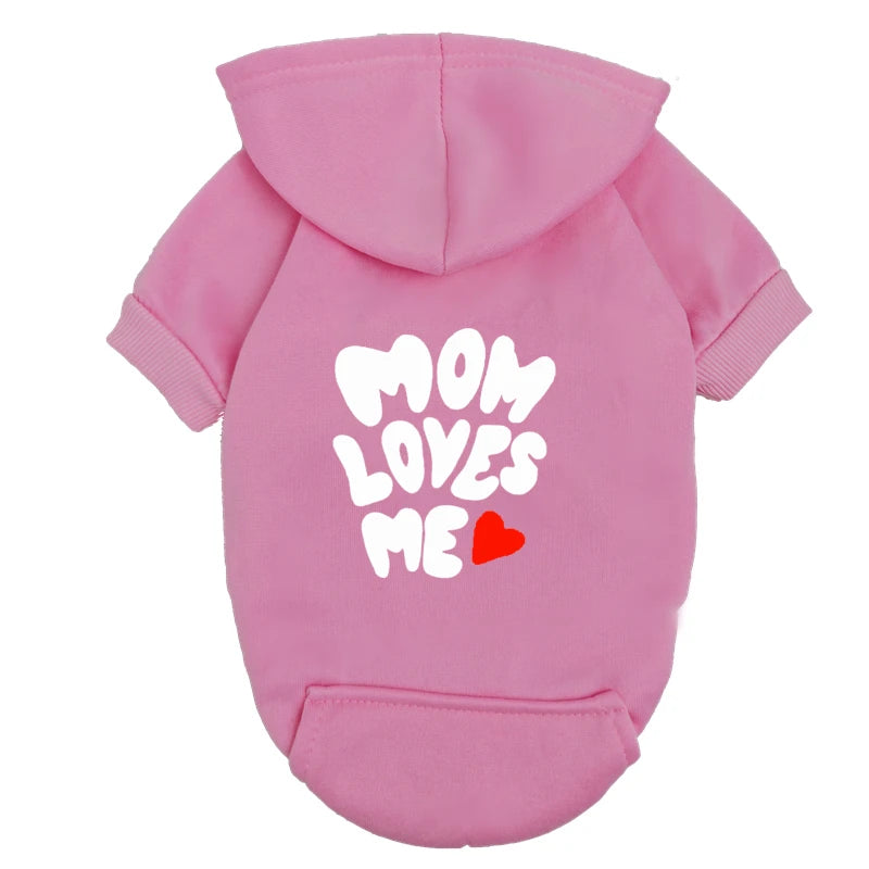 Pink dog hoodie with "Mom Loves Me" heart design. Warm sweater for small dogs and puppies. Cute pet gift outfit.