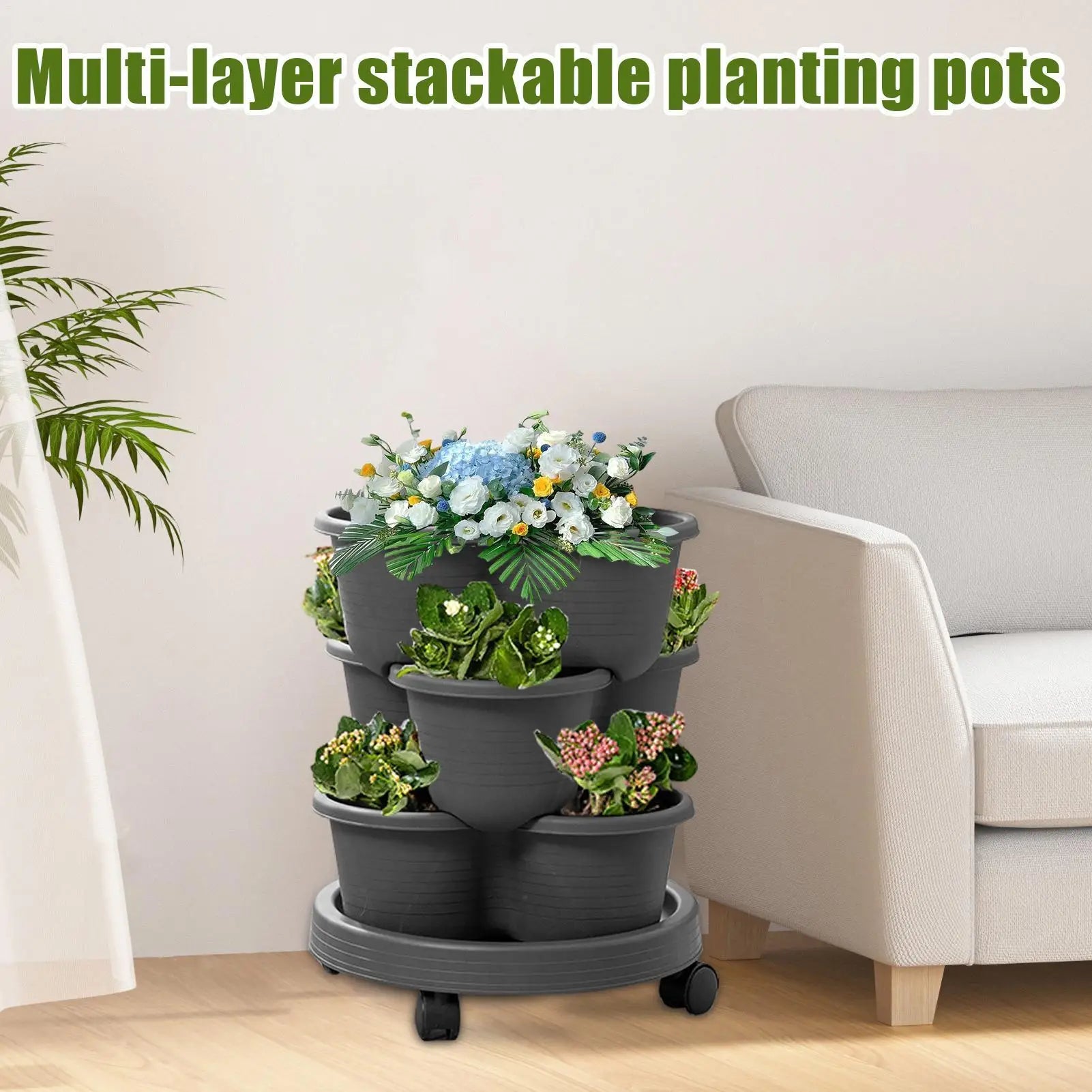 Dark grey stackable tiered planter tower with three pots and rolling wheels base.