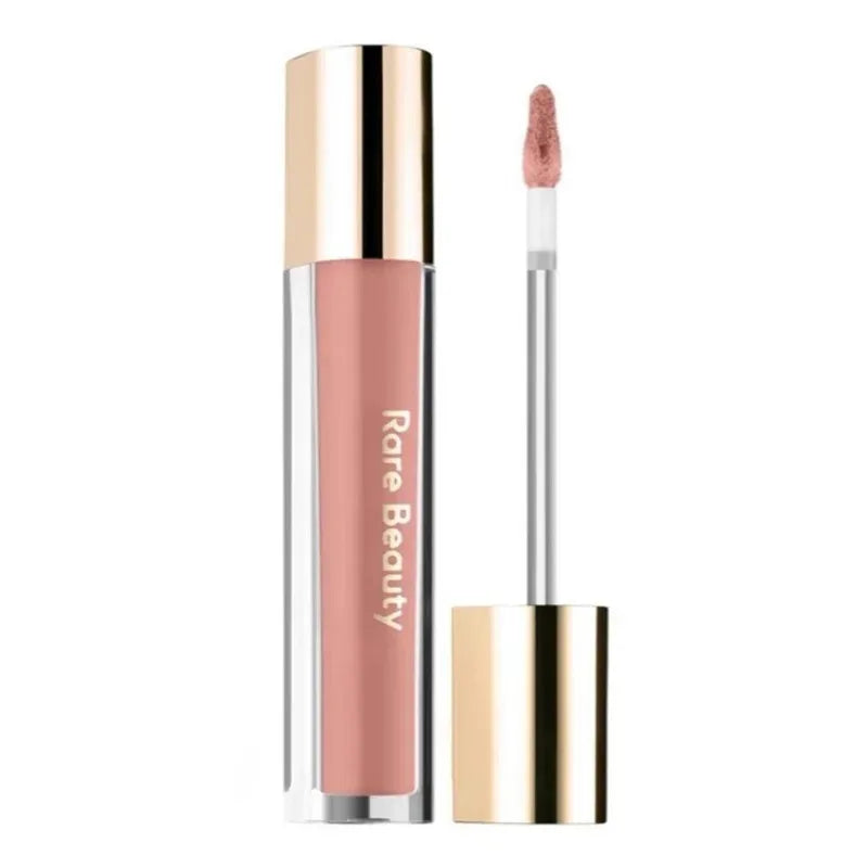 Rare Beauty Soft Pinch Tinted Lip Oil in a sheer, moisturizing nude pink formula with a gold applicator wand.