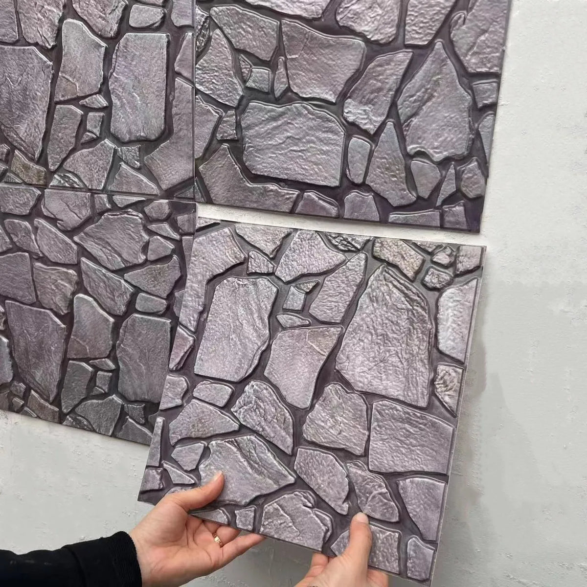 Slate-stone peel-and-stick tile backsplash squares in purple-gray embossed texture