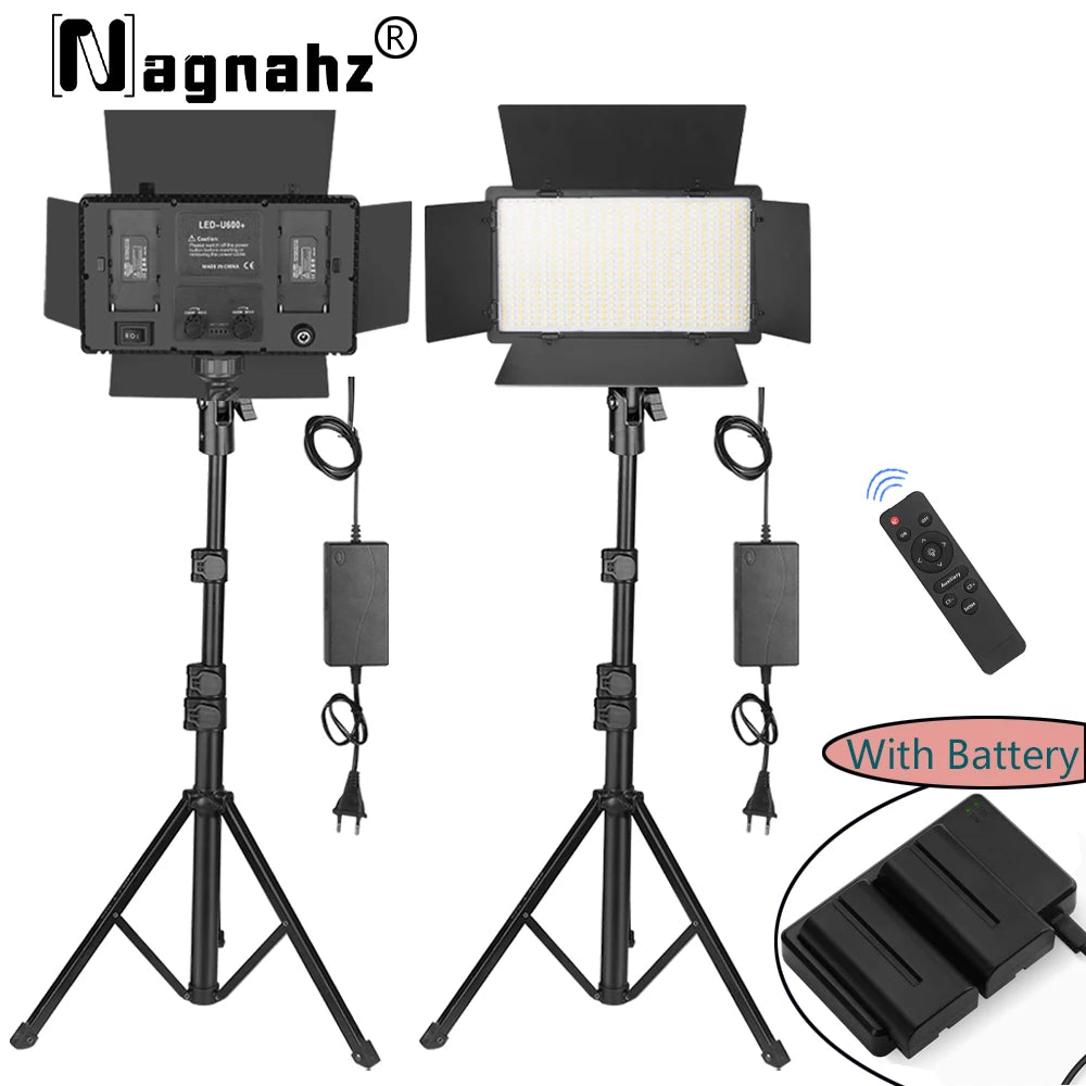 Rectangular LED video light with barn doors on a tripod stand, including power supply, remote control, and batteries.