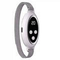White microcurrent sleep aid device with digital display, buttons, and grey wrist strap for anxiety relief.