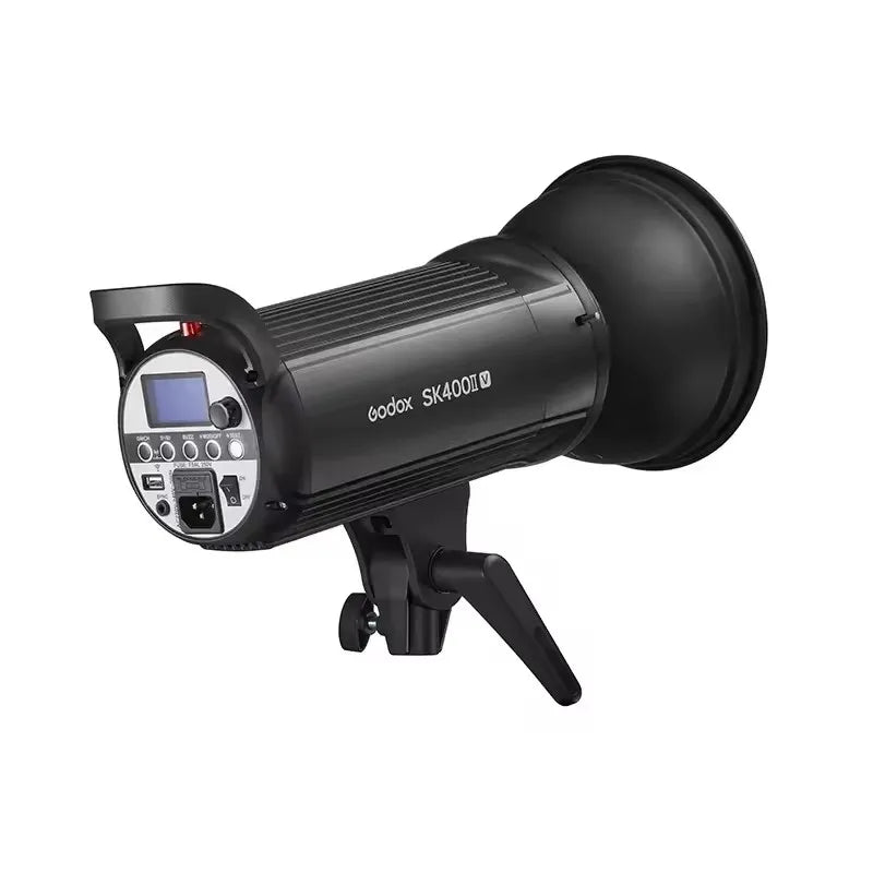 Black SK400II studio strobe light with a rear control panel, LCD screen, and attached reflector bowl on a mount.