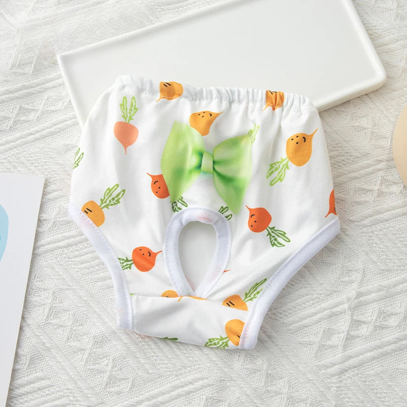 Washable carrot-print sanitary panties for female dogs, reusable cotton pet diaper shorts with a green bow.