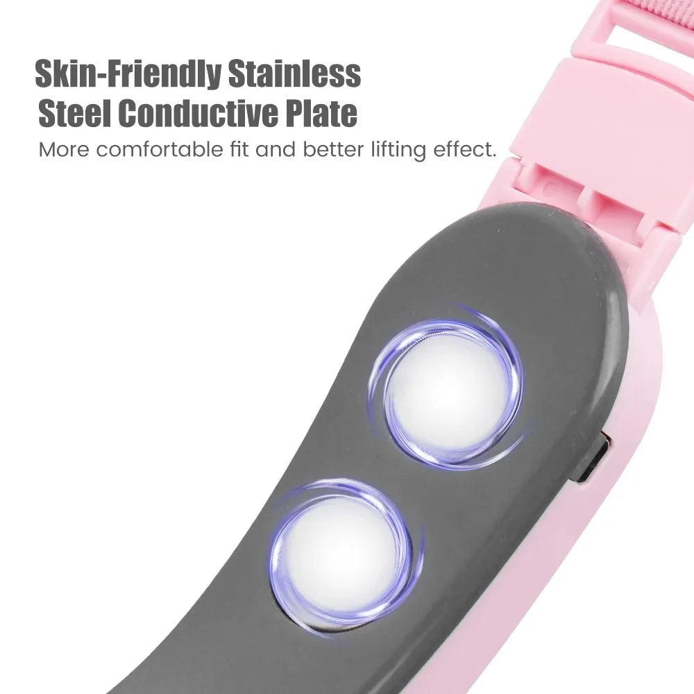 Pink electric V-face lifting device with two circular stainless steel conductive plates and light indicators.