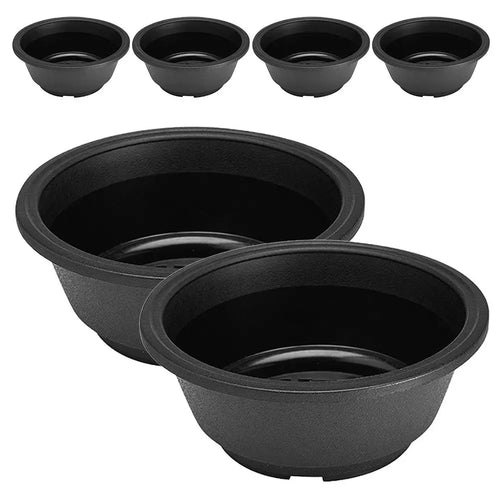 Set of 6 dark gray plastic plant pots, stacked front view with drainage holes