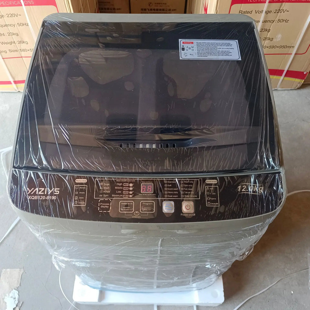 Tidesmit 12kg automatic washing machine with wave wheel, anti-winding tech, and blue light sterilization, side view.