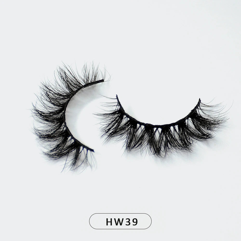 Pair of voluminous black 3D mink false eyelashes on a thin, flexible band, labeled HW39 on a white background.