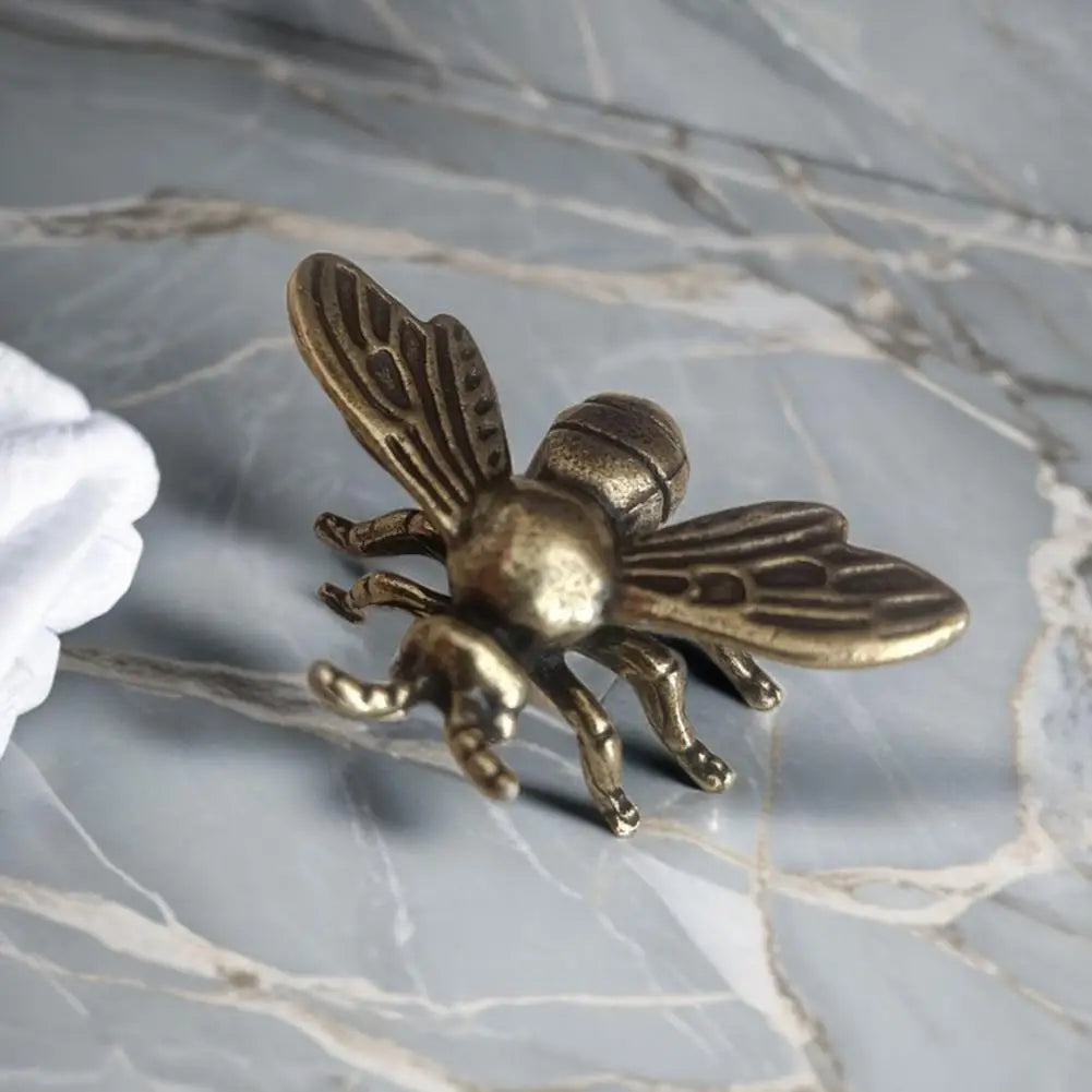 Solid brass bee tea pet figurine, a detailed golden metal insect sculpture for desk decor and tea ceremony display.