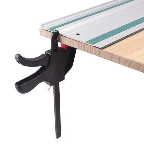 Single black F-clip clamp holding wood to a rail with red latch