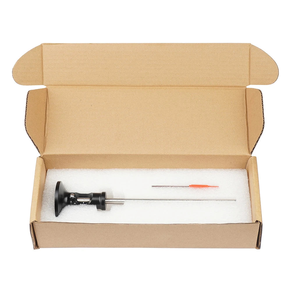Wheel marking gauge in open cardboard box with black body and orange-tipped rod