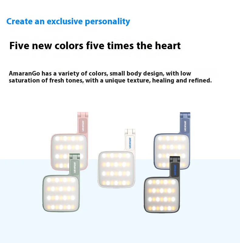 Five compact, square LED portable lights in pink, sage, white, blue, and black with adjustable folding arms.