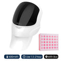 White and black wireless LED face and neck mask next to a pink patterned gift box.
