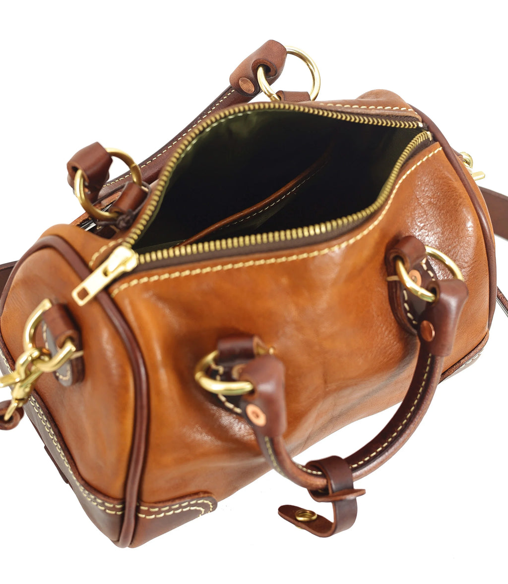 PNDME vintage tan genuine cowhide leather small handbag with top handles, brass hardware, and contrast stitching.
