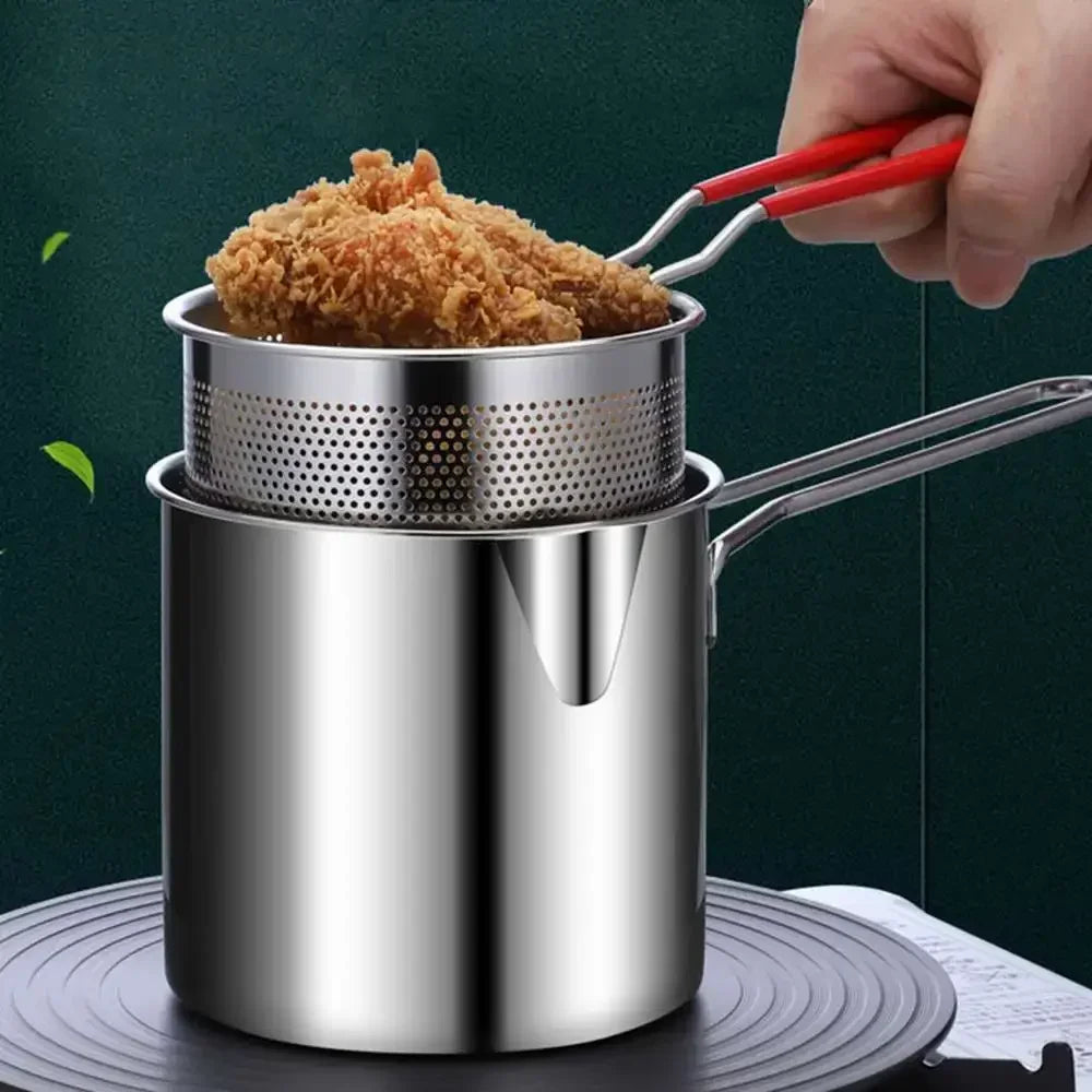 Stainless steel deep fryer with perforated basket and red-handled lifting tongs