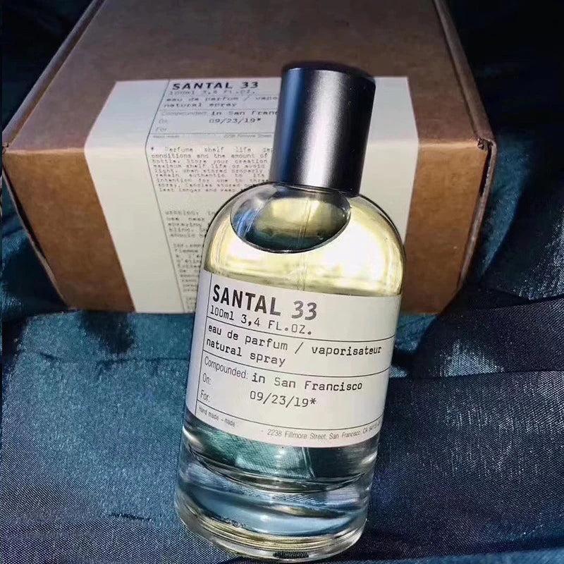 SANTAL 33 unisex Eau de Parfum 100ml spray. Iconic round glass bottle with minimalist white label for cult fragrance.