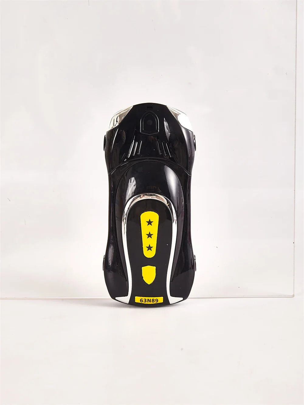 Unlocked Bluetooth dialer phone, black body with yellow star label, front view