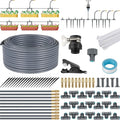 DIY drip irrigation kit components: gray tubing, connectors, drippers, stakes, filter