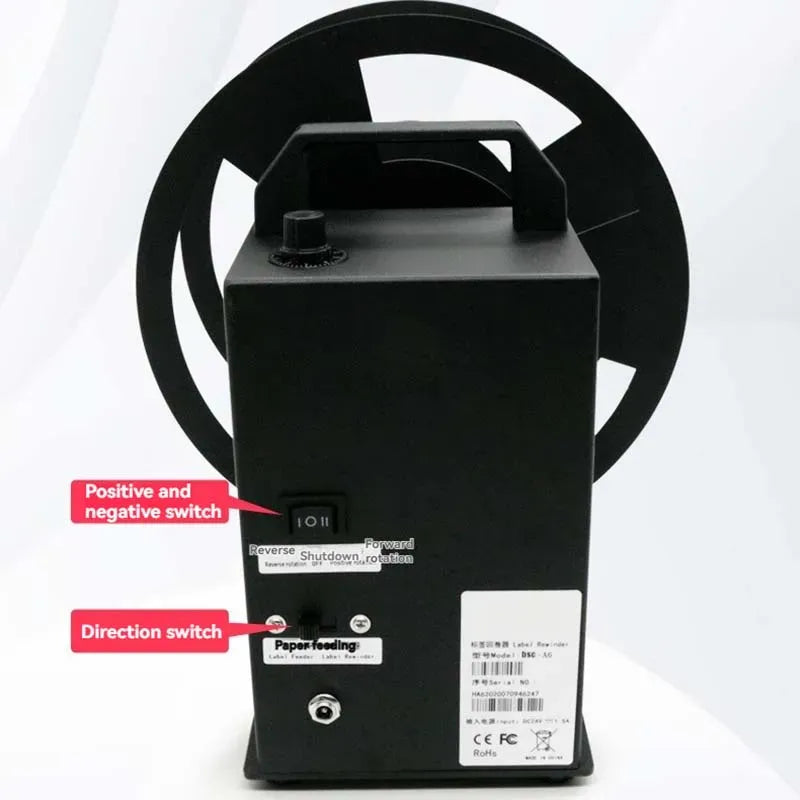 Automatic label rewinder with top handle, large black circular rollers, and control panel