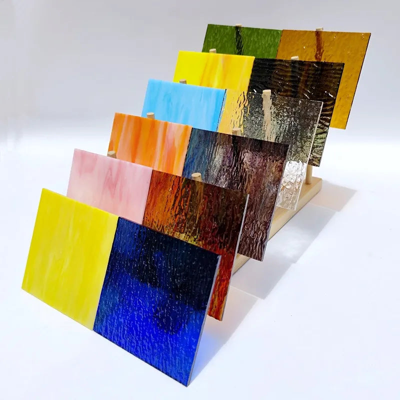 Set of 12 textured transparent stained glass mosaic tiles, mixed blue, yellow, orange tones