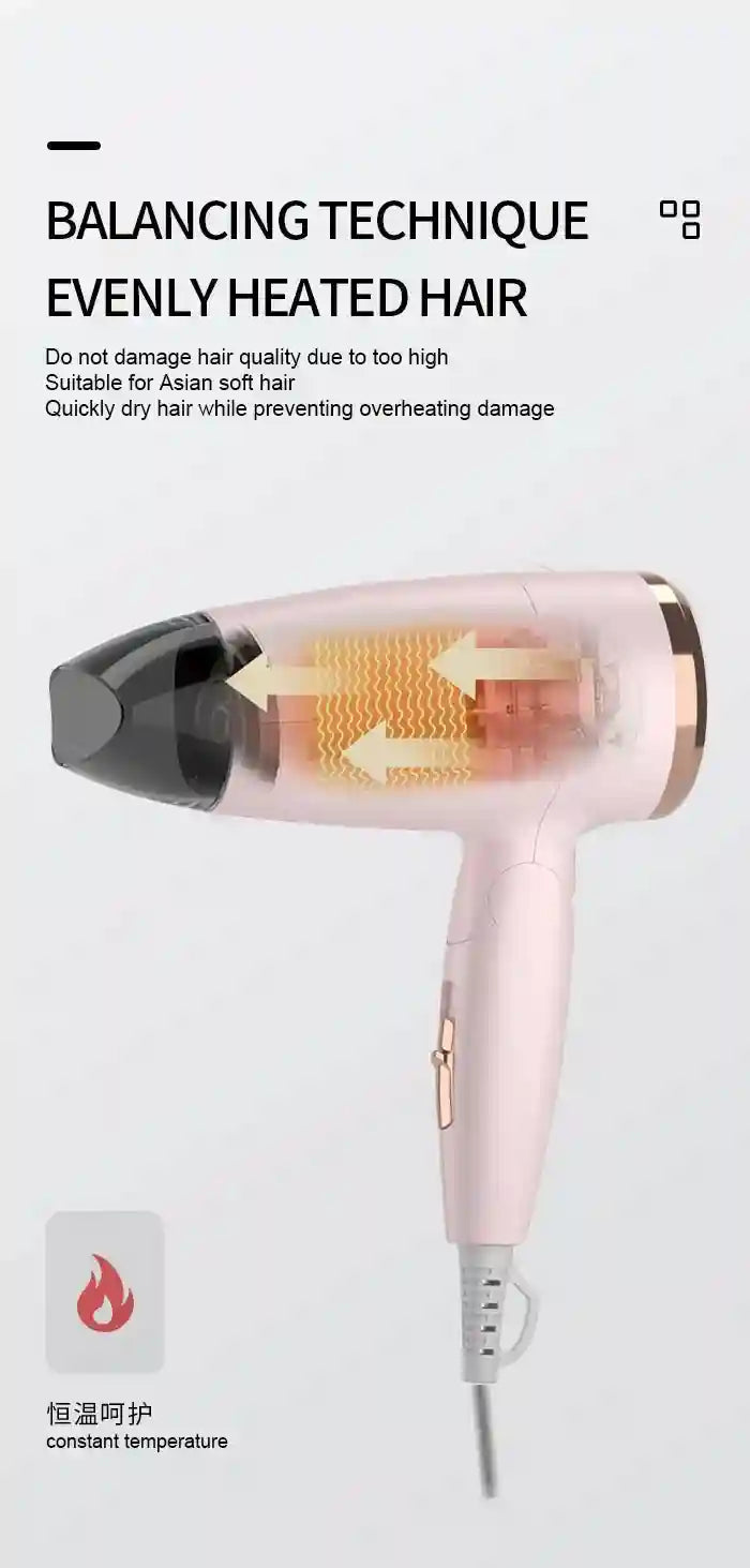 Kemei portable pink travel hair dryer with concentrator nozzle, 950W, foldable design, and constant heat protection.