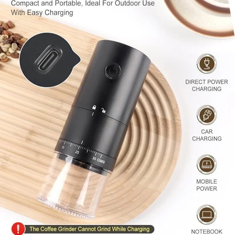 Portable electric coffee grinder, matte black cylindrical design with clear grounds container and USB charging port.