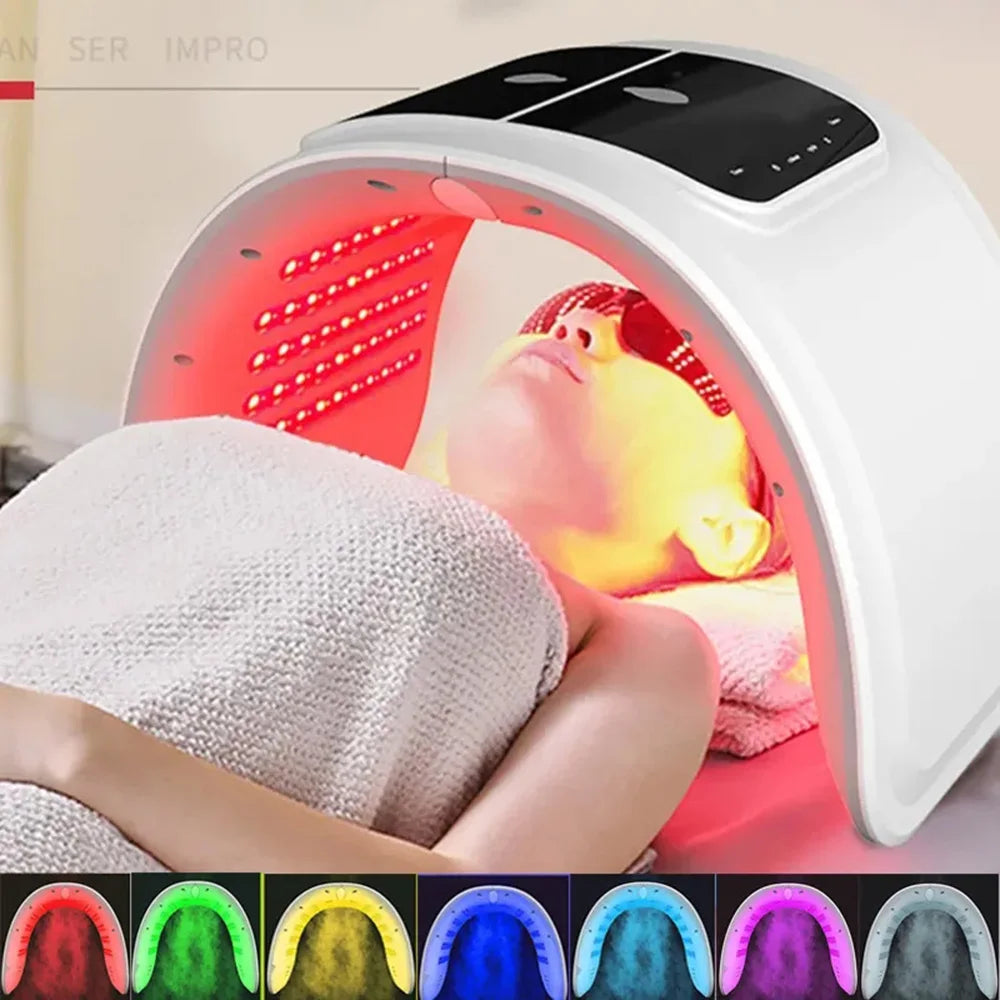 White arched LED light therapy machine for face skincare, featuring multiple color settings and a digital control panel.