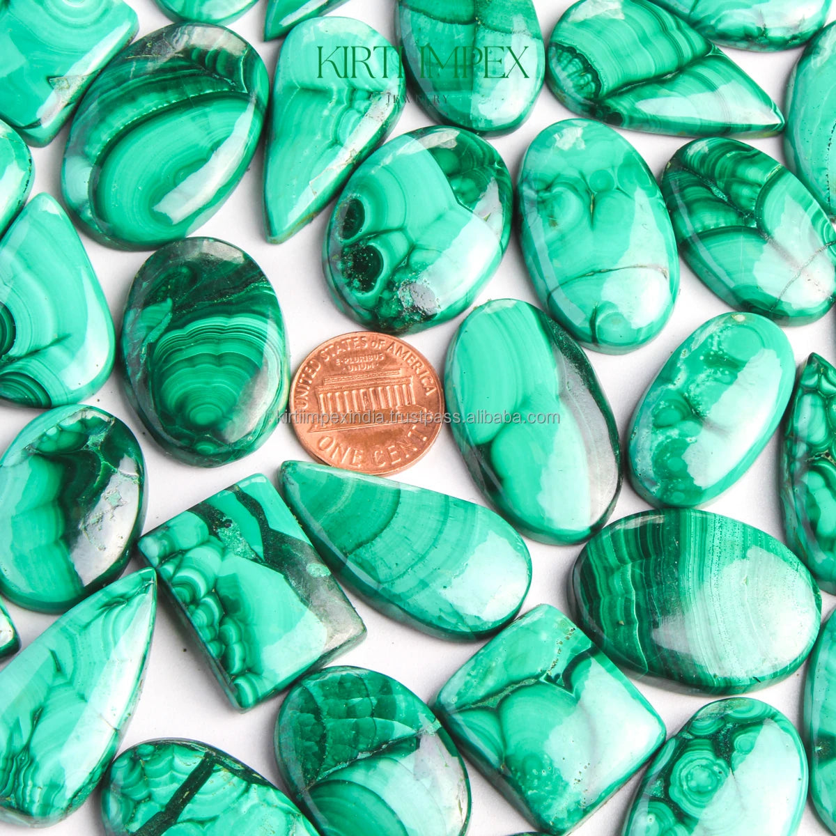 Mixed green malachite cabochons in oval and teardrop shapes with banded patterns
