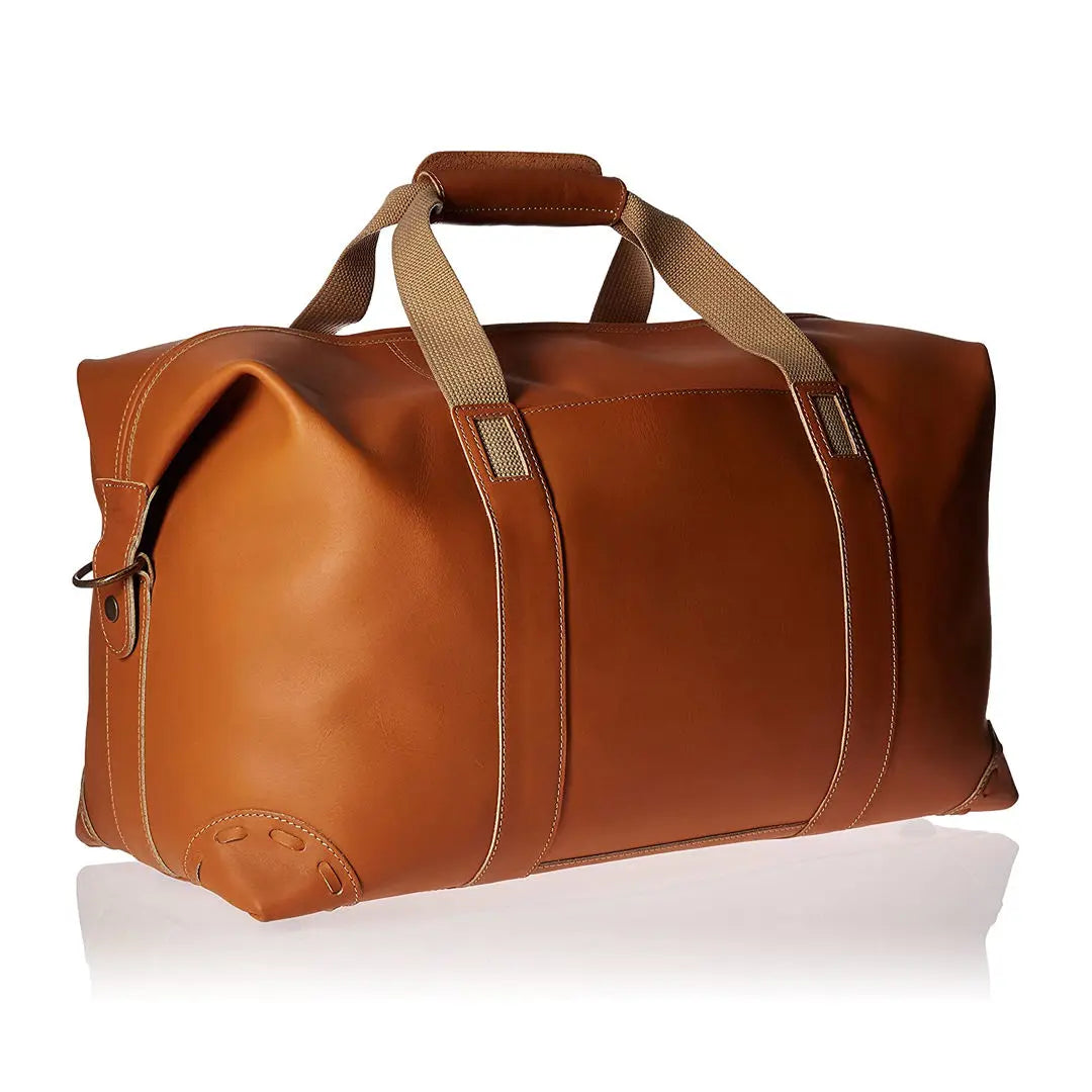 Tan PU leather travel duffel trunk with sturdy woven handles, reinforced base, and spacious capacity for gear.
